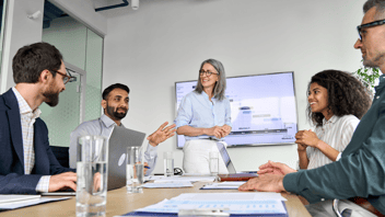 female leader during meeting with team