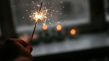 person holding sparkler