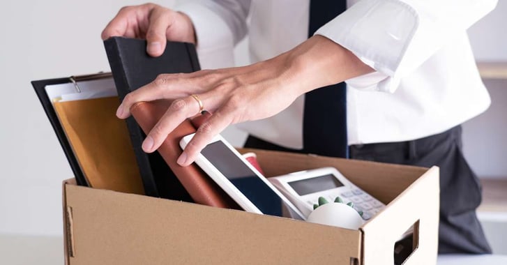 Man packing work things into a box