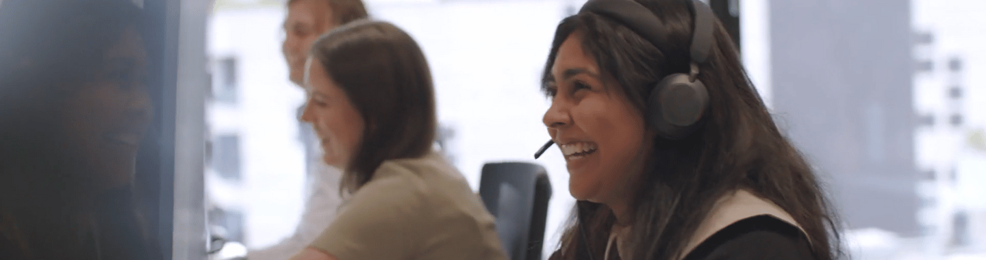 picture of a young woman on the phone smiling 