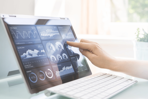 image showing a hand touching a dashboard on their laptop