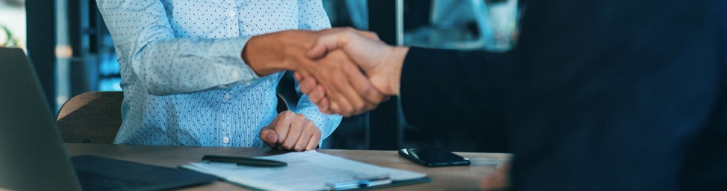 two people shaking hands