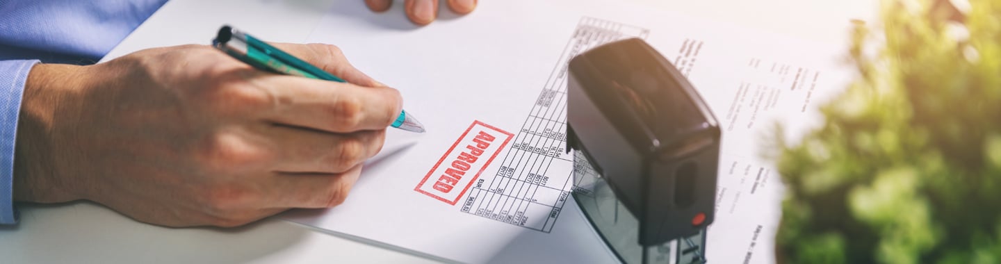 picture of a man signing a document