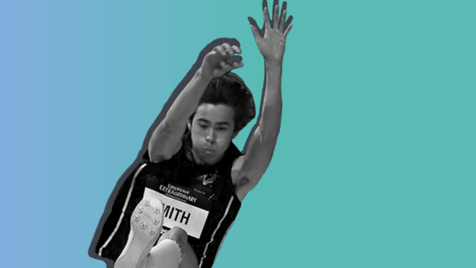 Photo of olympic long jumper Henry Smith mid-jump