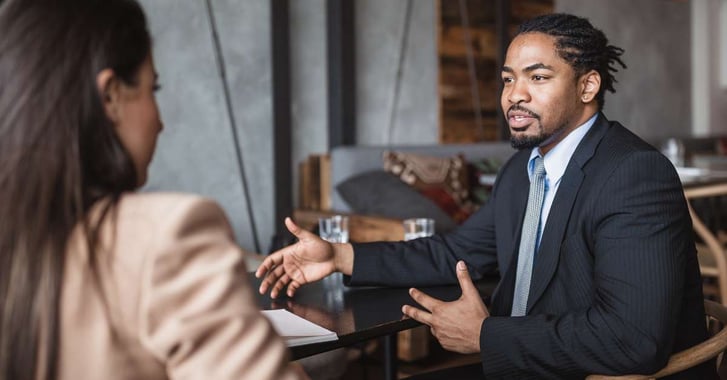 Man pitching in an interview