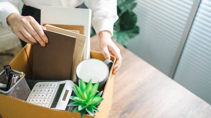 woman packing her work belongings in a box