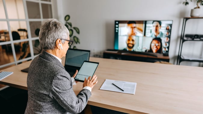 Person in office in online meeting